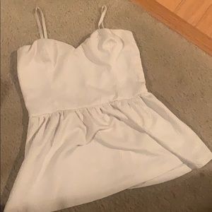 White sleeveless peplum top